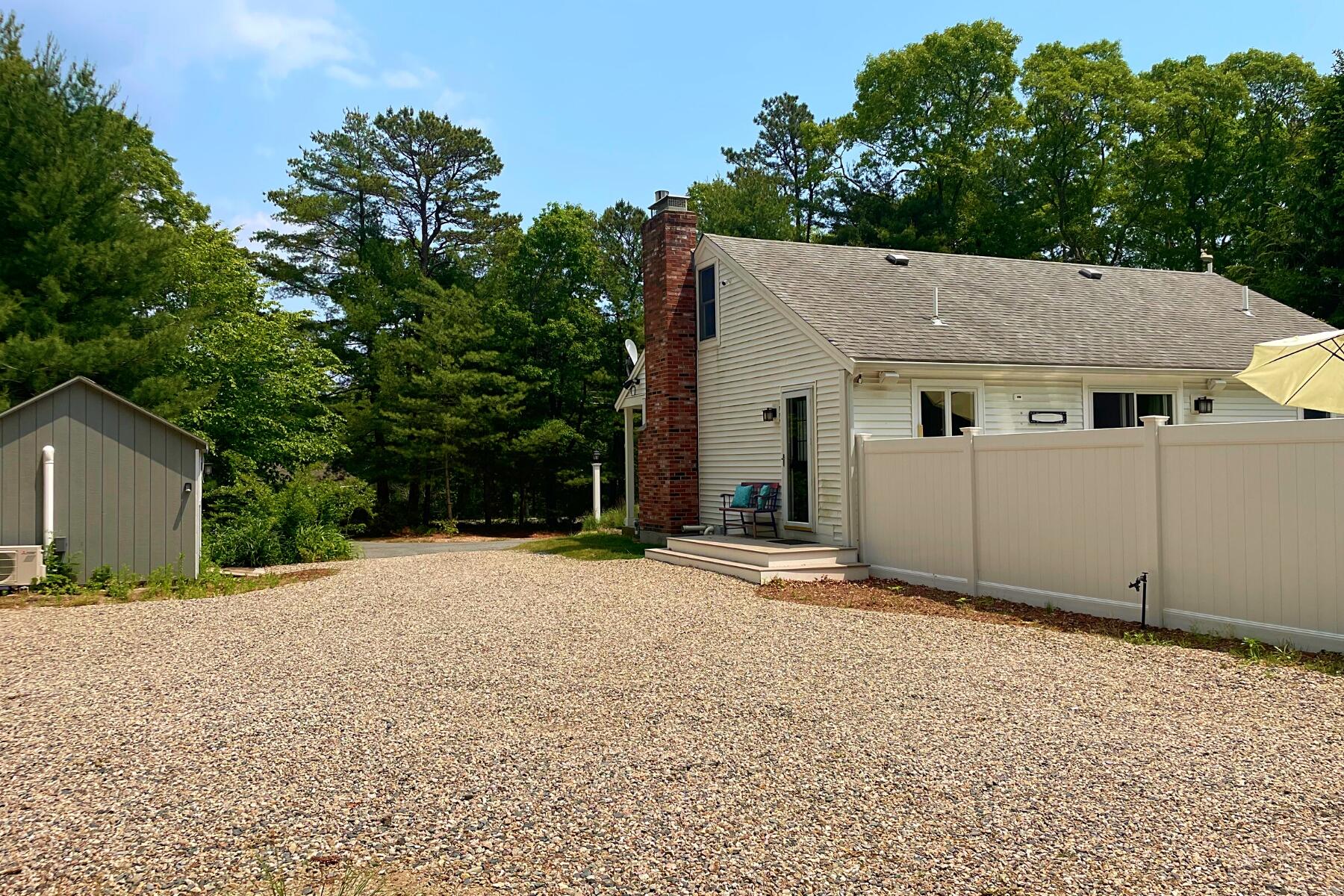 263 Cammett Road Marstons Mills, MA 02648 - Photo 27 of 33 a view of a house with a yard and garage