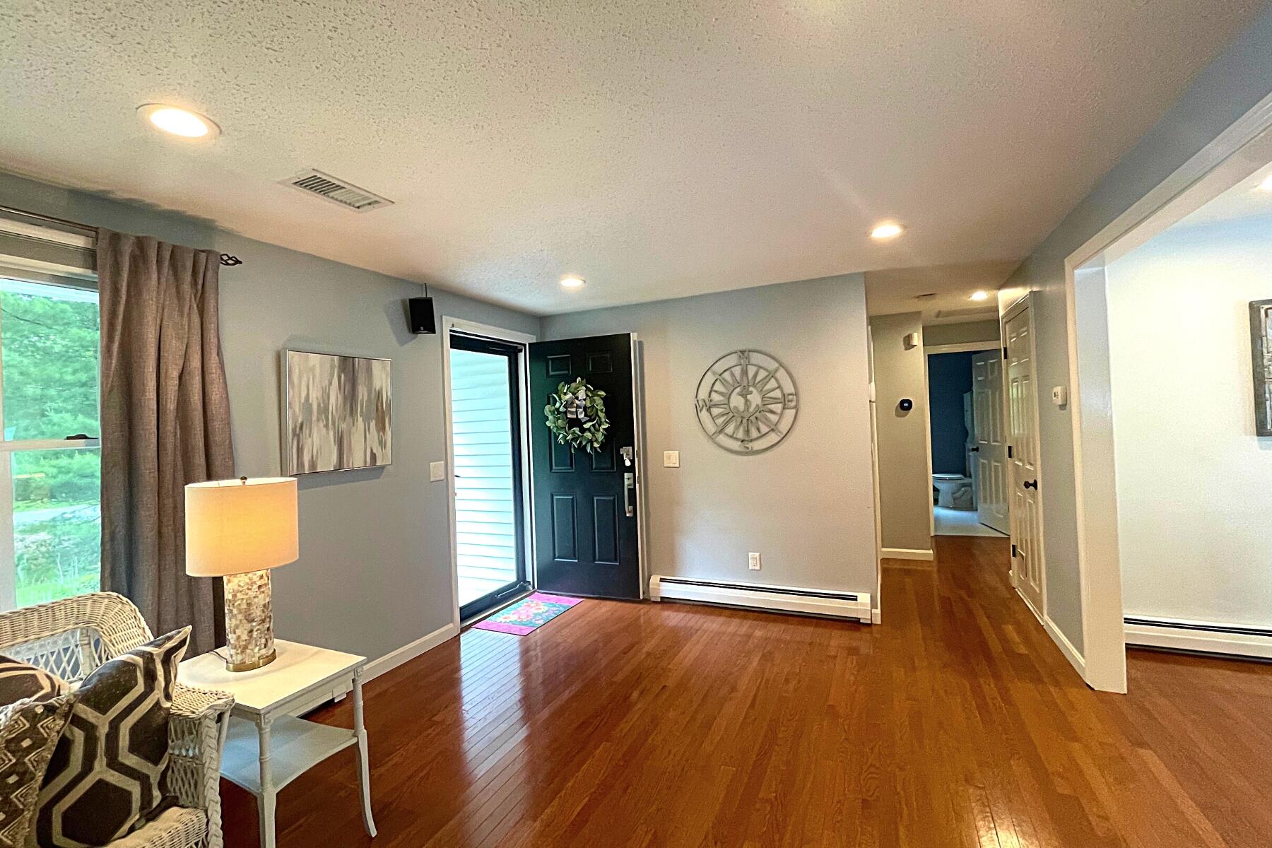263 Cammett Road Marstons Mills, MA 02648 - Photo 4 of 33 a view of dining room and wooden floor