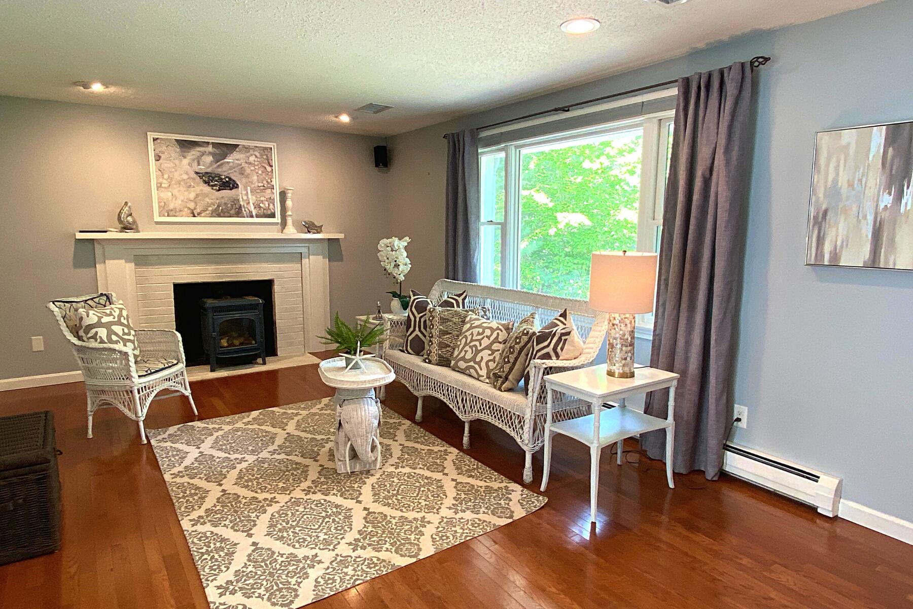 263 Cammett Road Marstons Mills, MA 02648 - Photo 6 of 33 a living room with furniture and a fireplace