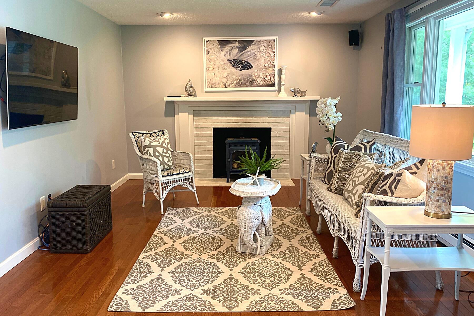 263 Cammett Road Marstons Mills, MA 02648 - Photo 8 of 33 a living room with furniture and a fireplace
