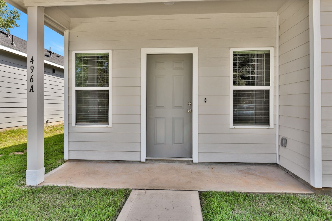496 Golden Street, Unit A Willis, TX 77378 - Photo 2 of 26 a view of house with backyard