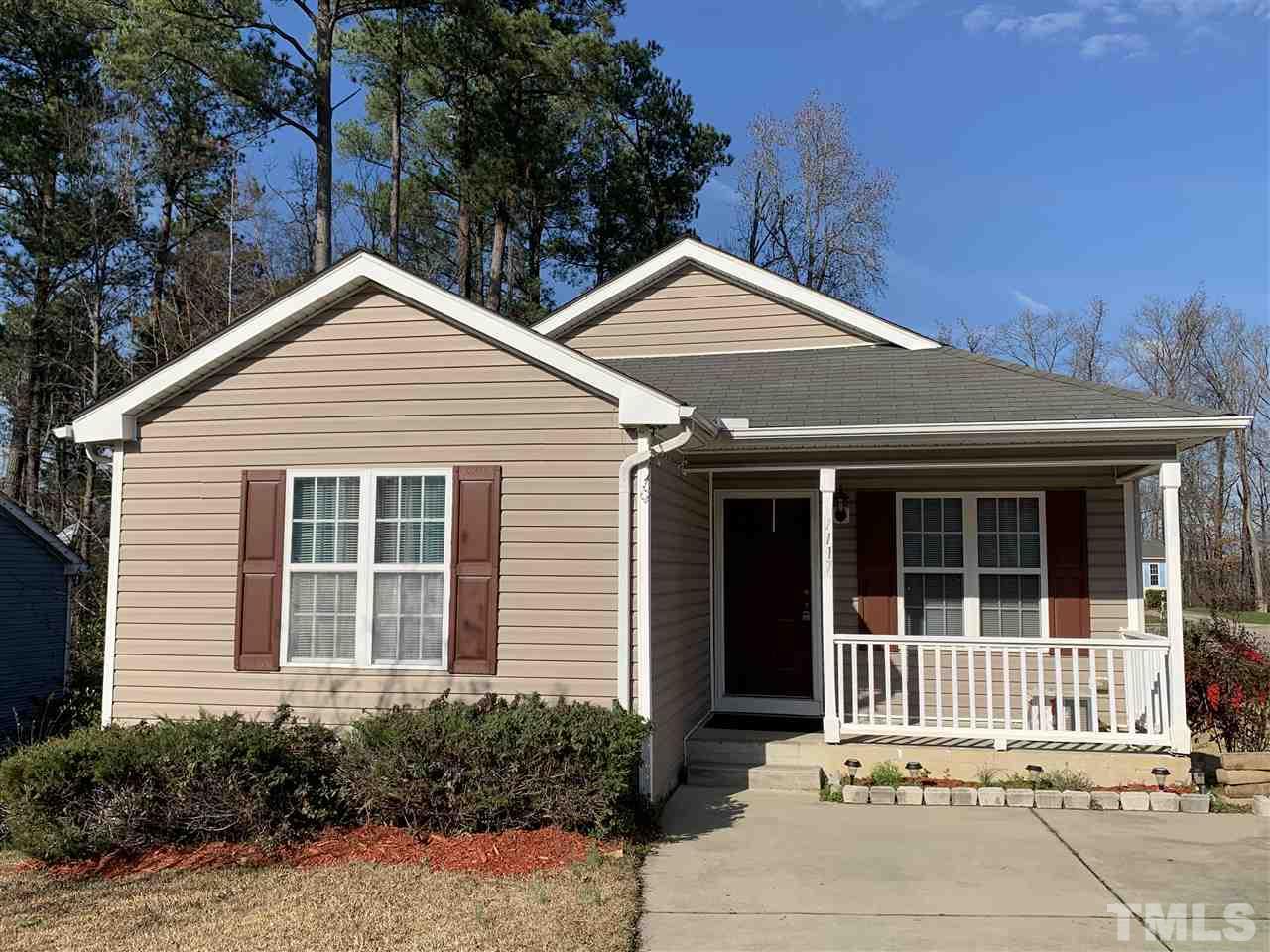a front view of a house with a garage