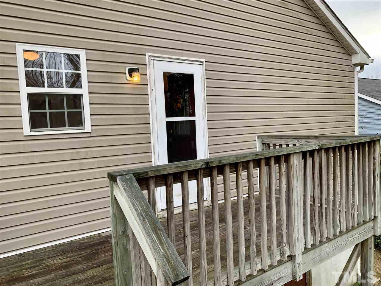 1117 Thelonious Drive Raleigh, NC 27610 - Photo 20 of 25 a view of a house with a deck