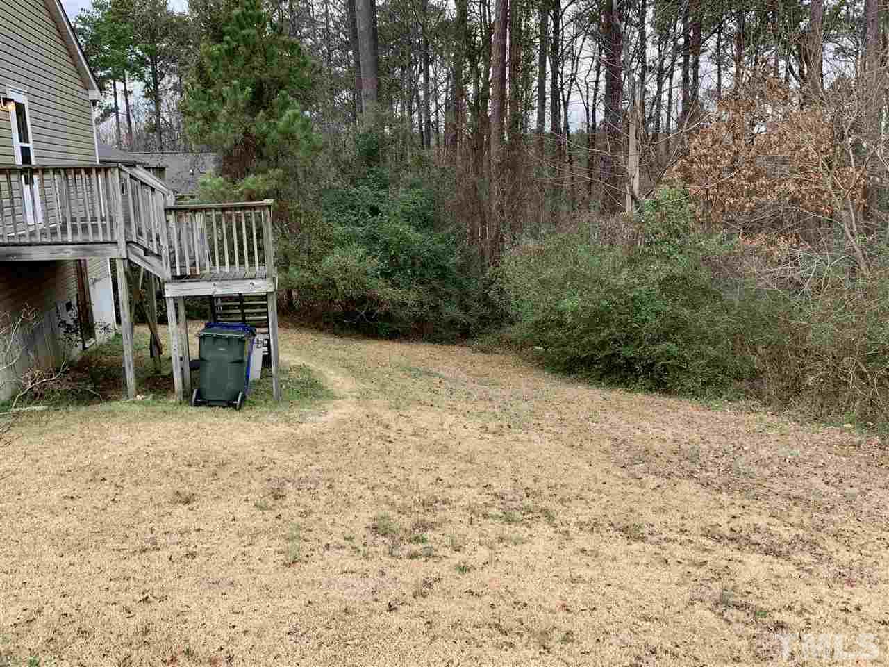 1117 Thelonious Drive Raleigh, NC 27610 - Photo 22 of 25 a backyard of a house with lots of green space