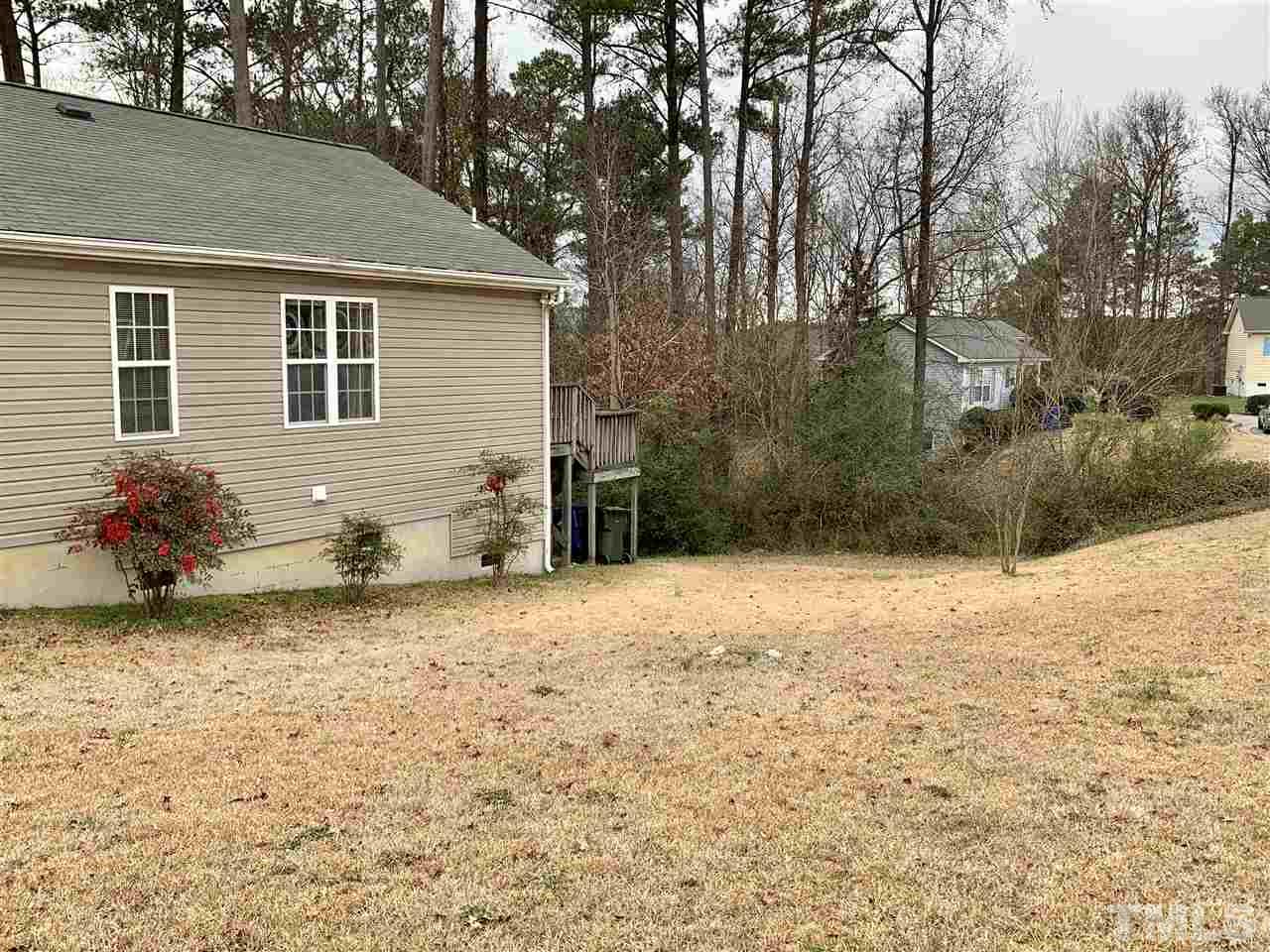 1117 Thelonious Drive Raleigh, NC 27610 - Photo 24 of 25 a backyard of a house