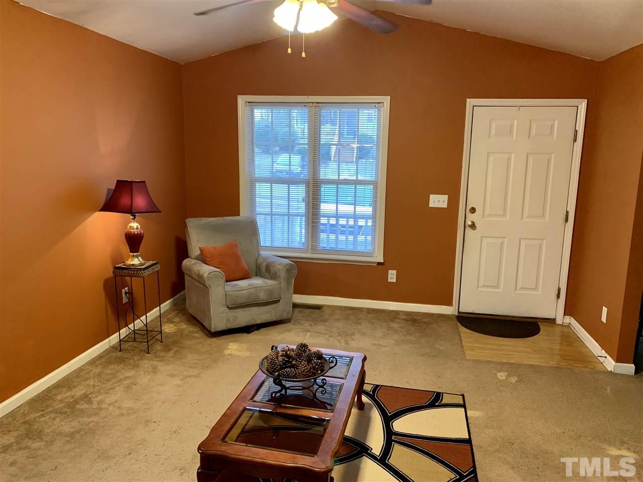 1117 Thelonious Drive Raleigh, NC 27610 - Photo 5 of 25 a living room with furniture and a window