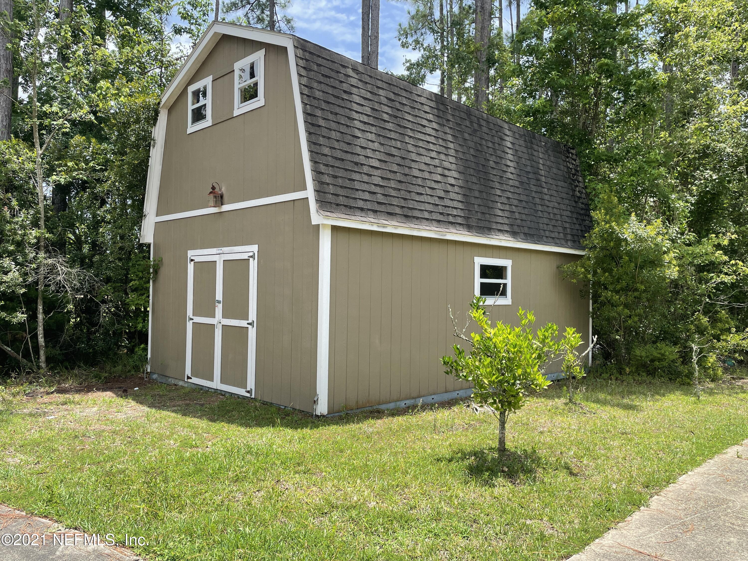 127 Foxcraft Street St. Augustine, FL 32092 - Photo 20 of 77 a house that has a tree in front of the house