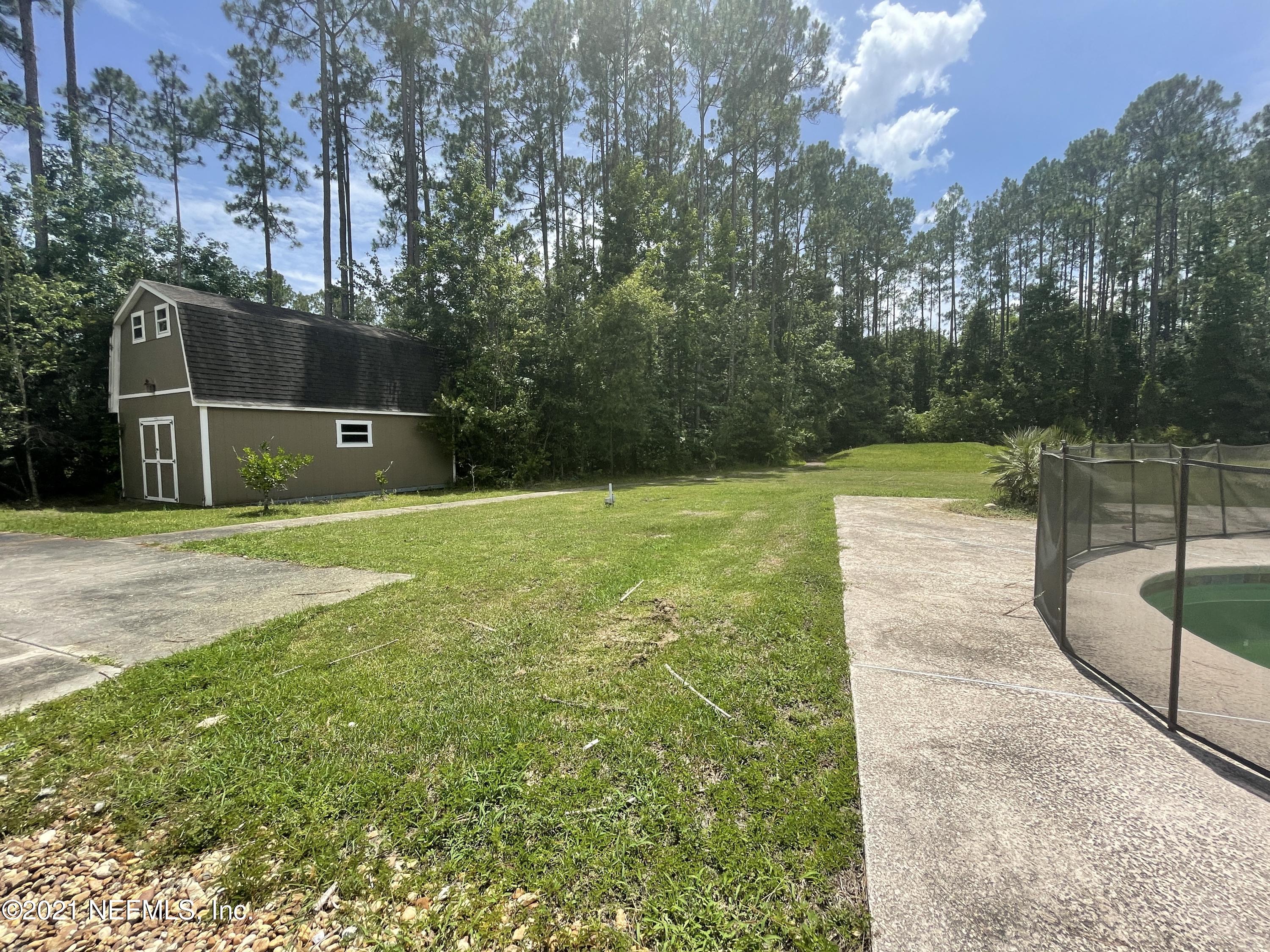 127 Foxcraft Street St. Augustine, FL 32092 - Photo 25 of 77 a swimming pool with wooden fence