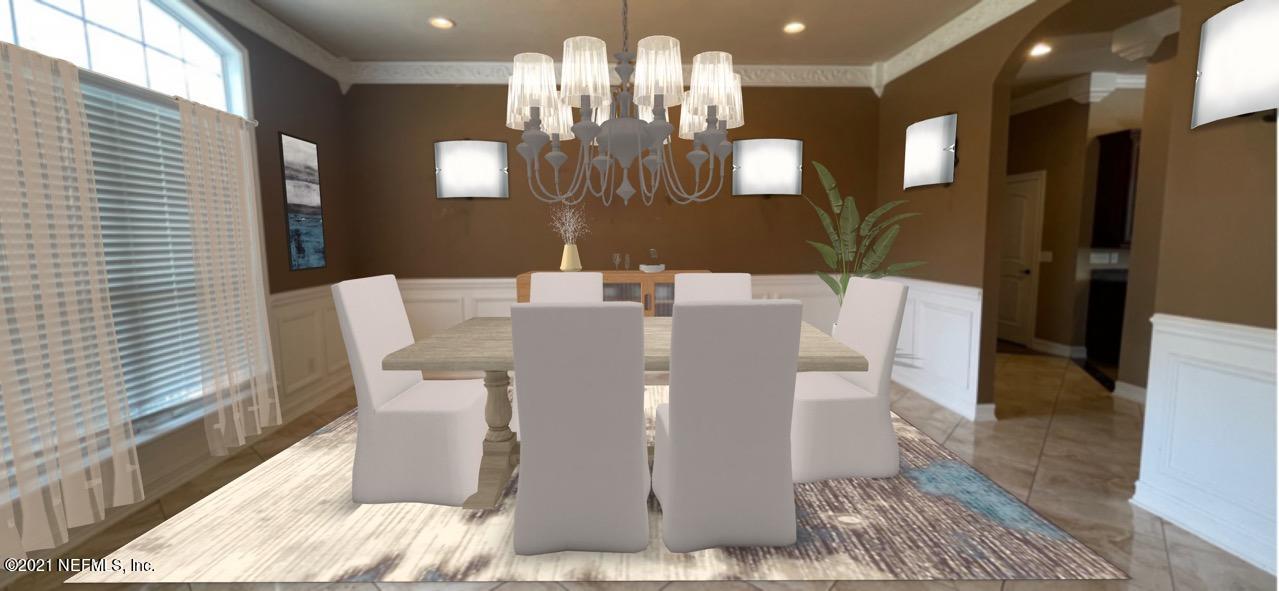 127 Foxcraft Street St. Augustine, FL 32092 - Photo 29 of 77 a view of a dining room with furniture and chandelier