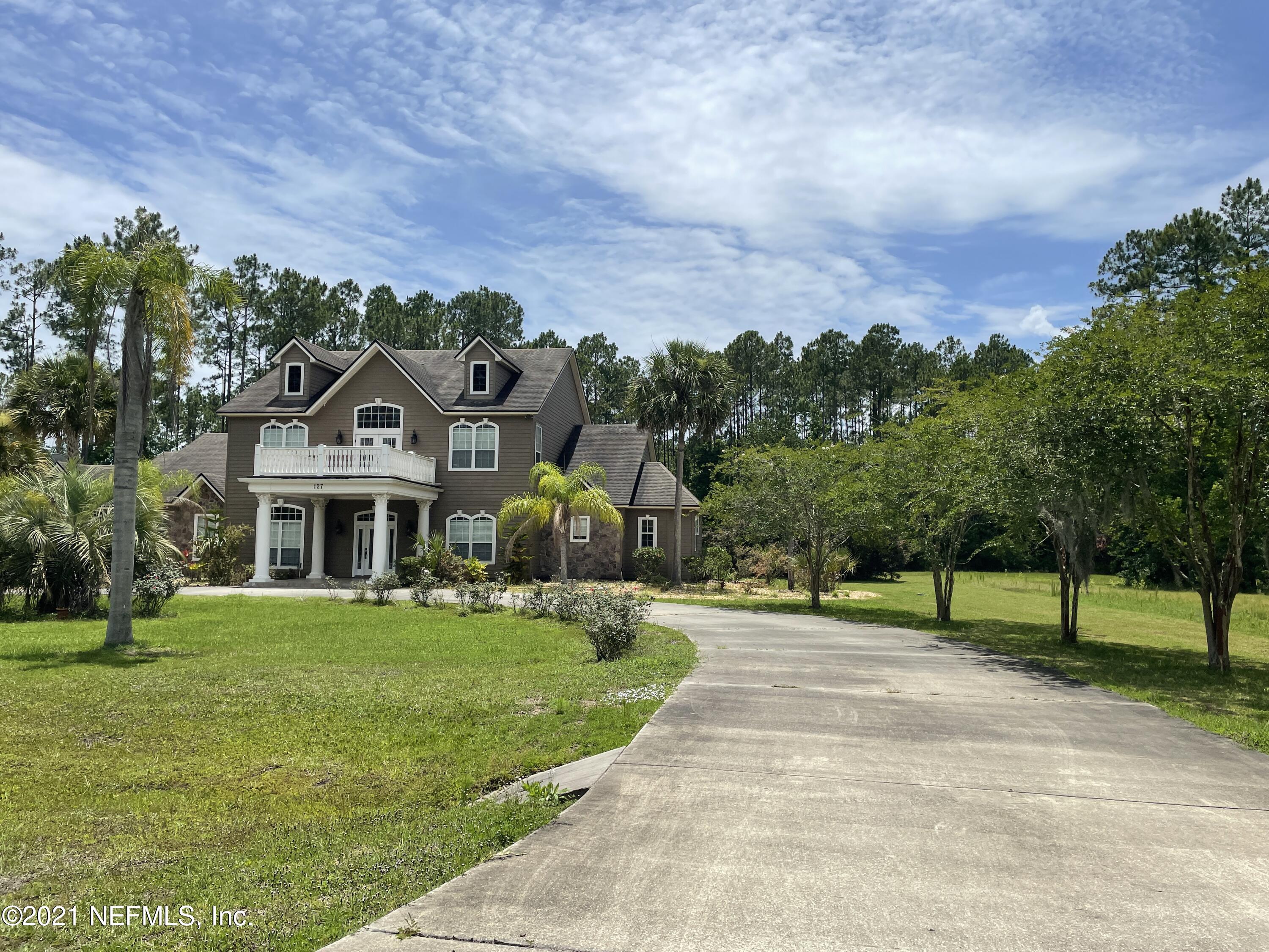 127 Foxcraft Street St. Augustine, FL 32092 - Photo 4 of 77 a front view of a house with a yard