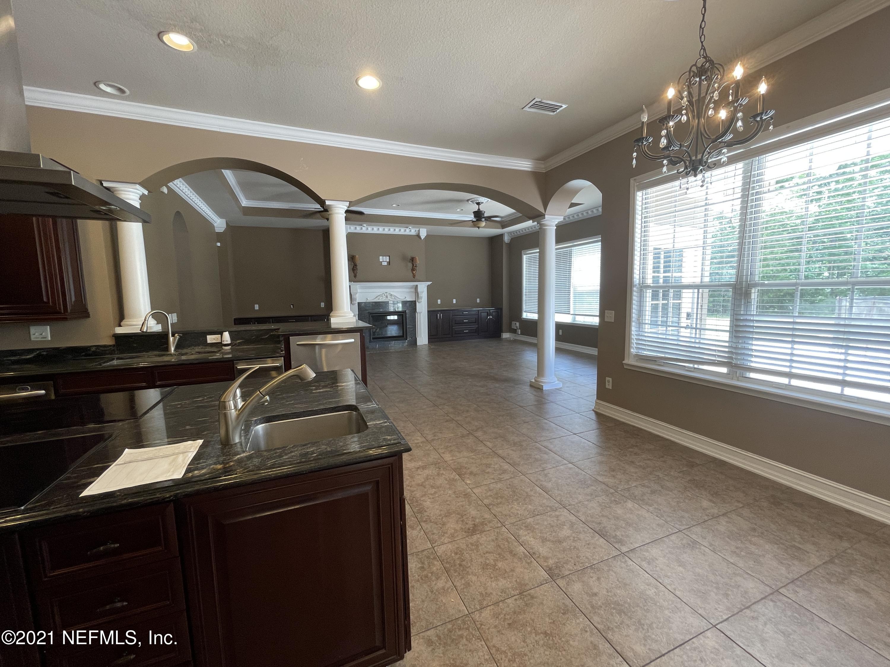 127 Foxcraft Street St. Augustine, FL 32092 - Photo 46 of 77 a kitchen with a sink and a large window