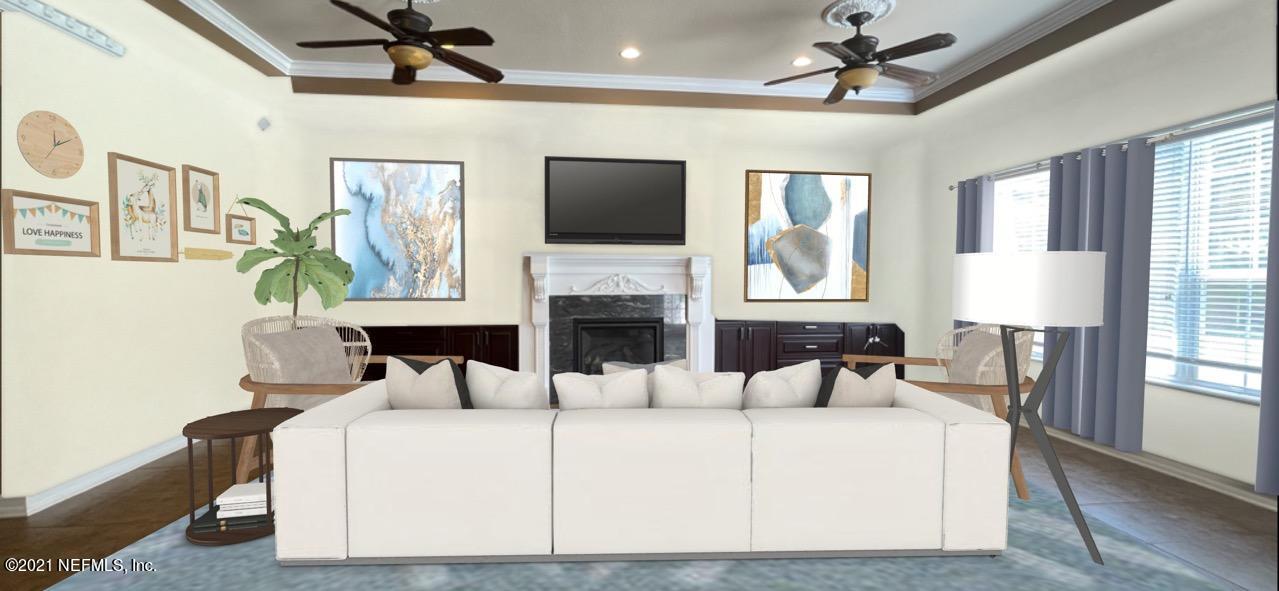 127 Foxcraft Street St. Augustine, FL 32092 - Photo 50 of 77 a living room with furniture fireplace and flat screen tv