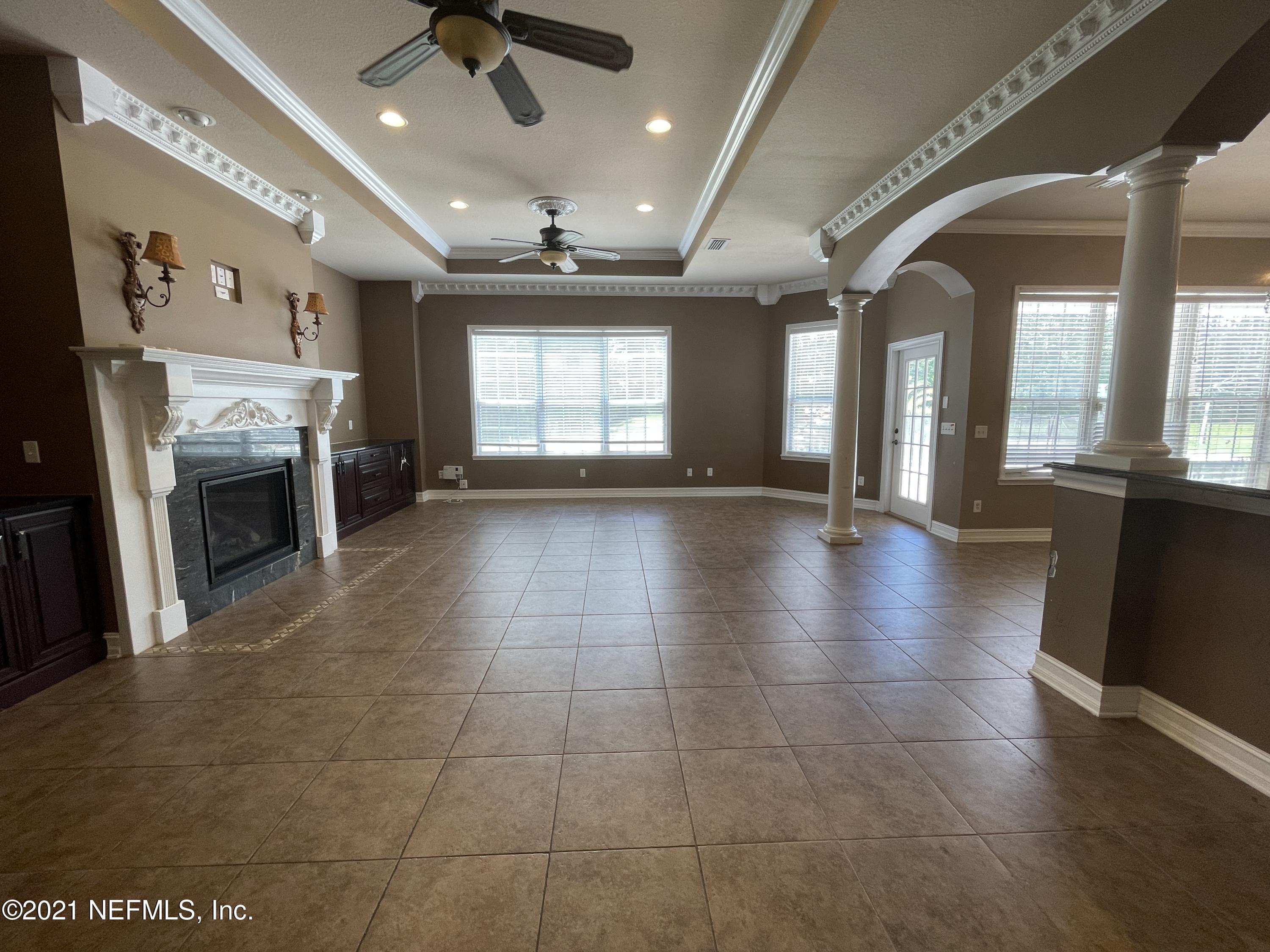 127 Foxcraft Street St. Augustine, FL 32092 - Photo 51 of 77 an empty room with windows and a fireplace