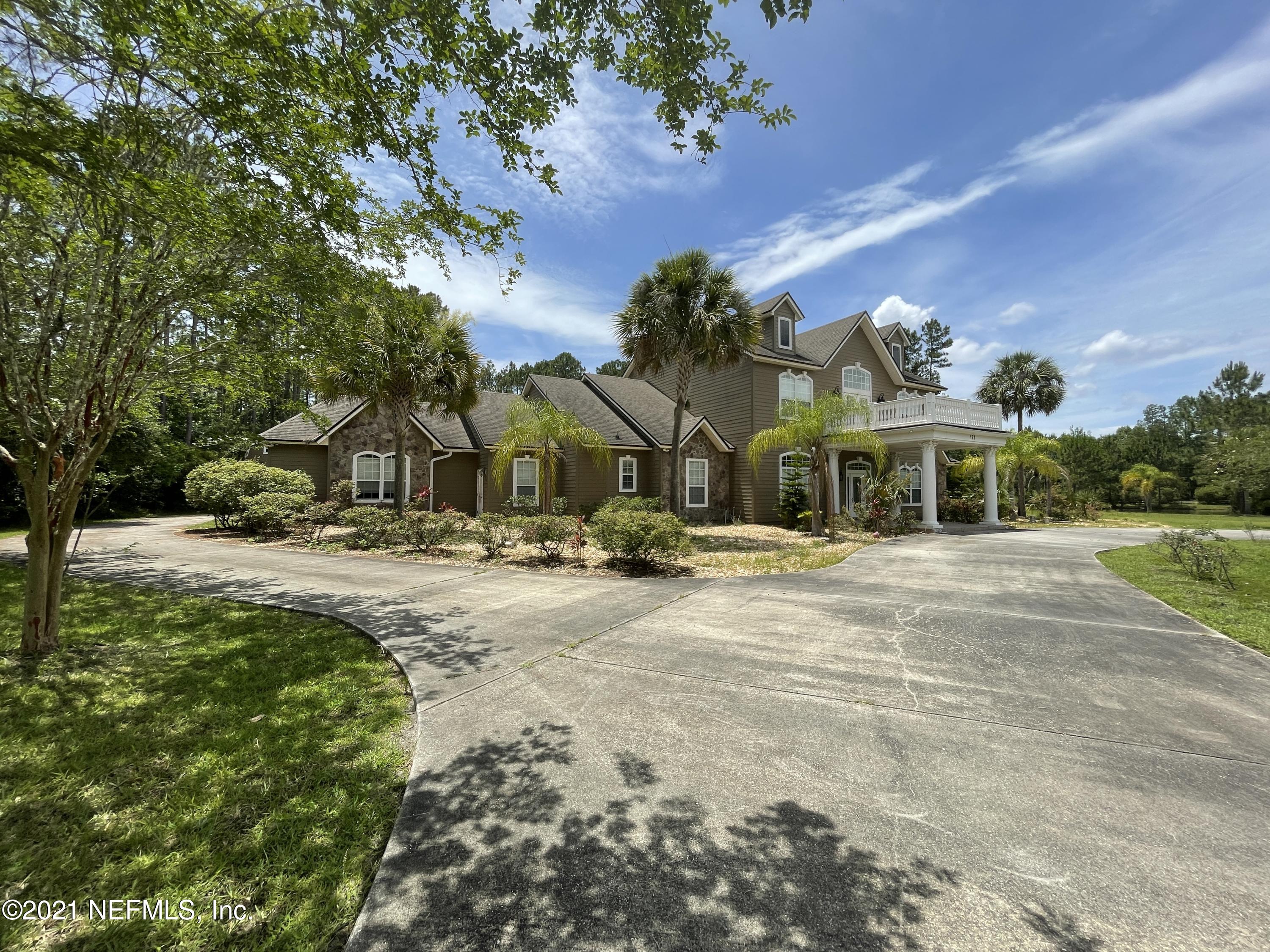 127 Foxcraft Street St. Augustine, FL 32092 - Photo 6 of 77 a view of yard with tree in front of it