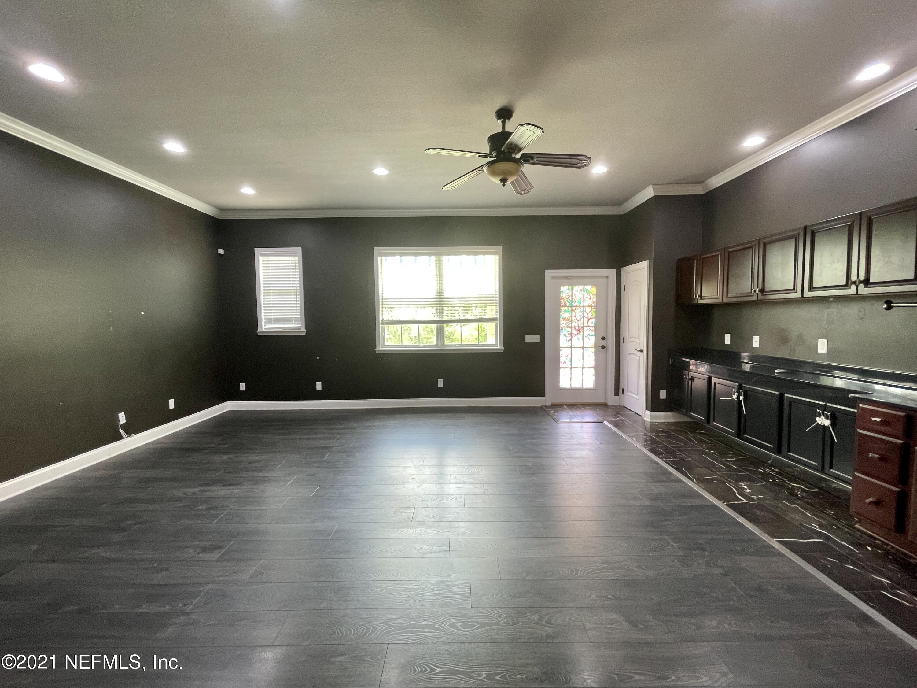 127 Foxcraft Street St. Augustine, FL 32092 - Photo 63 of 77 a view of a kitchen with a sink and a stove top oven
