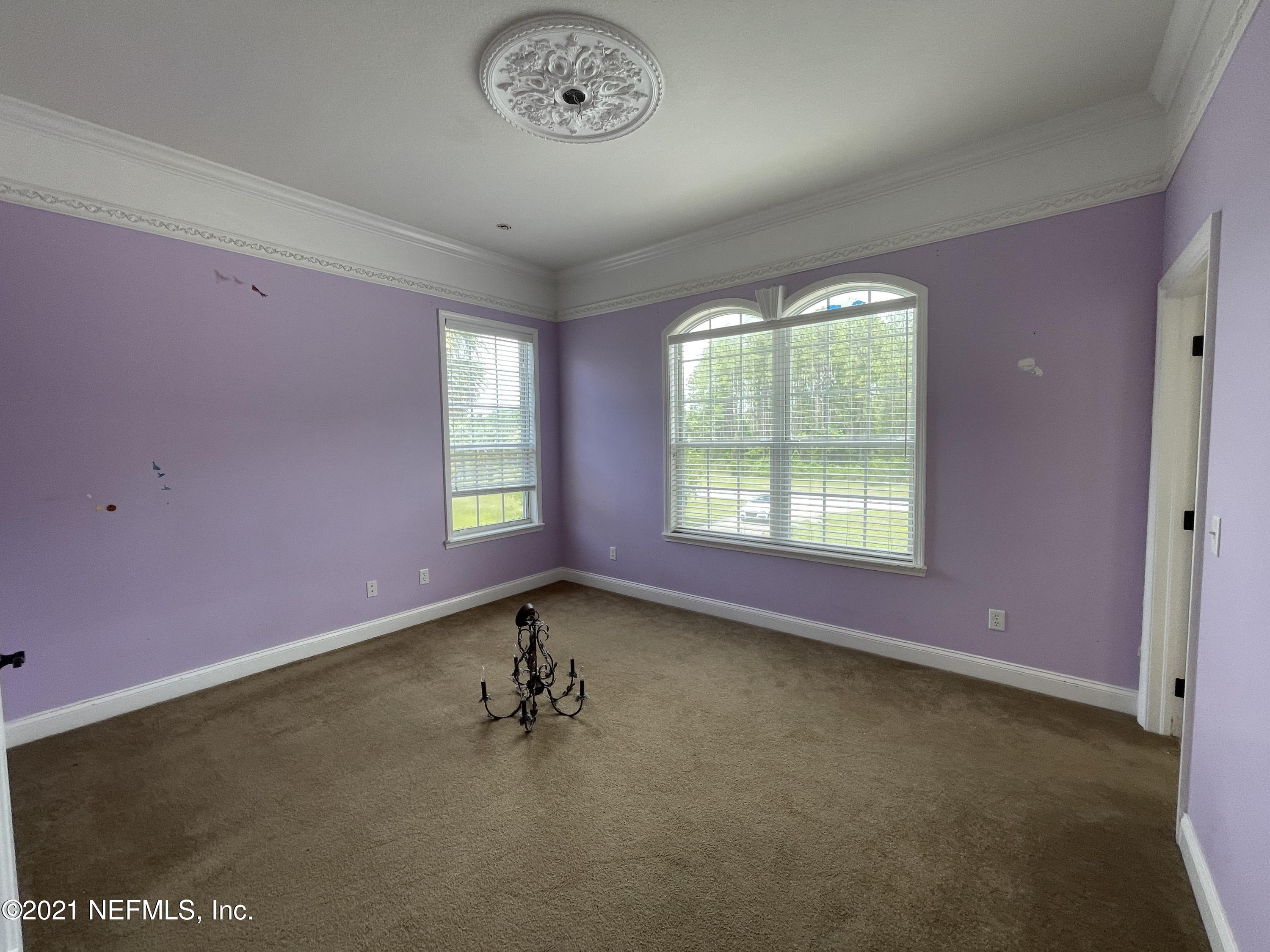 127 Foxcraft Street St. Augustine, FL 32092 - Photo 67 of 77 an empty room with a empty space and windows