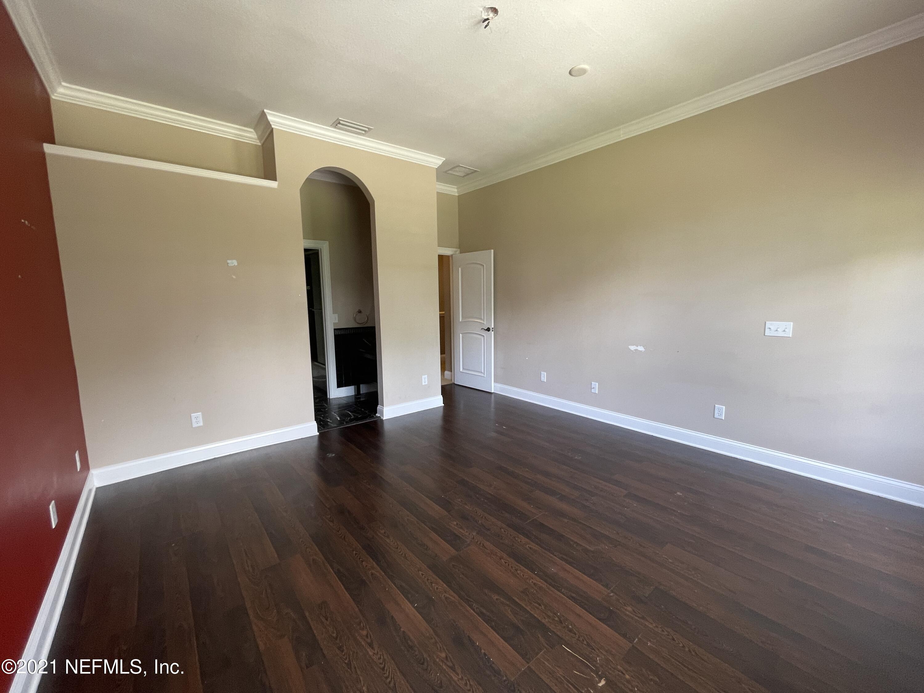 127 Foxcraft Street St. Augustine, FL 32092 - Photo 72 of 77 a view of an empty room with wooden floor and a window