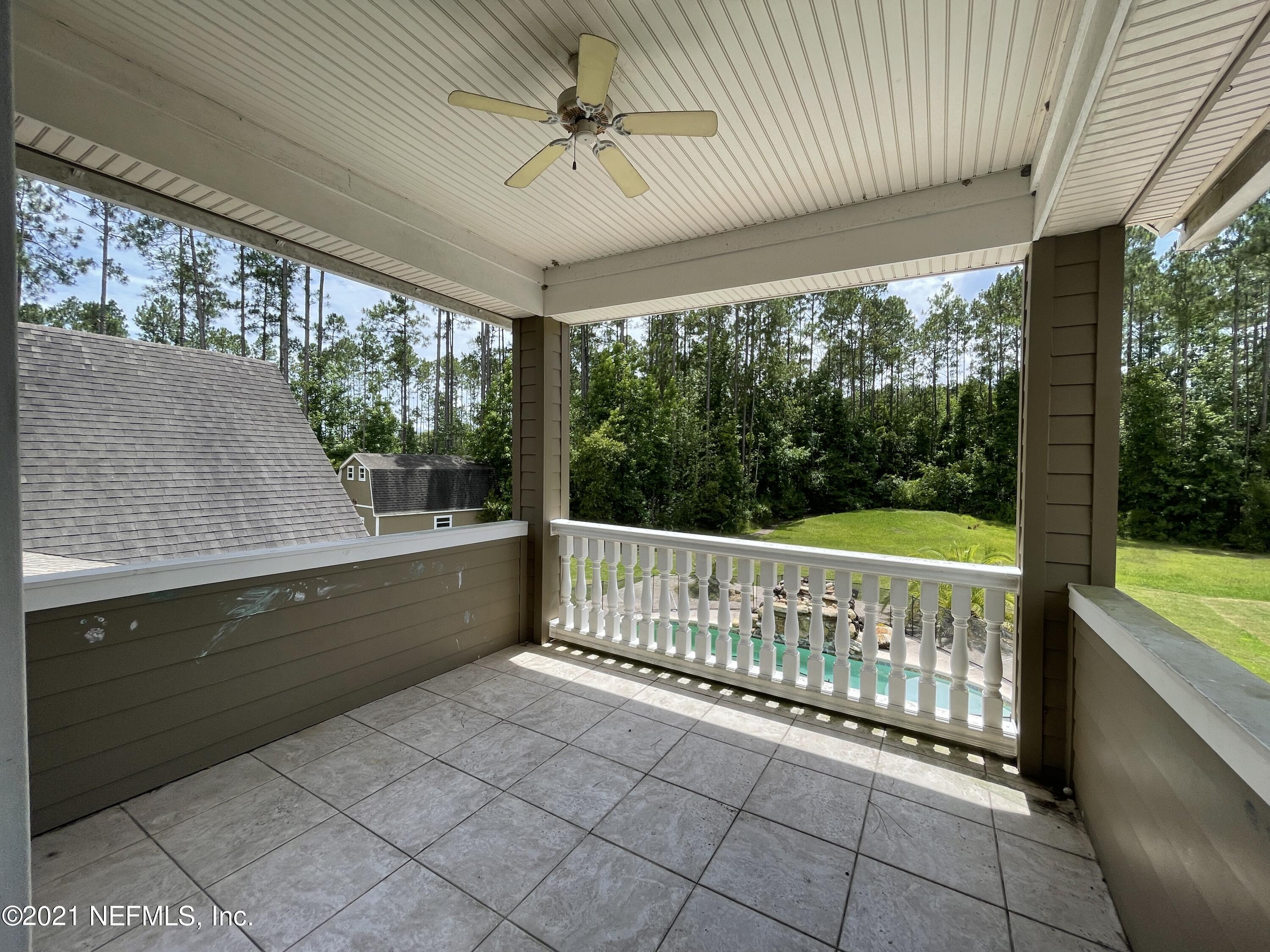 127 Foxcraft Street St. Augustine, FL 32092 - Photo 74 of 77 a view of a porch with wooden floor and outdoor seating