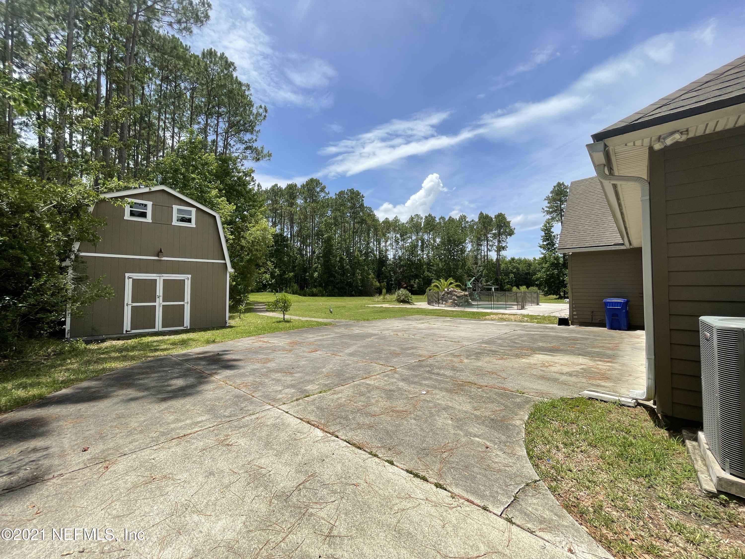 127 Foxcraft Street St. Augustine, FL 32092 - Photo 8 of 77 a front view of a house with a yard