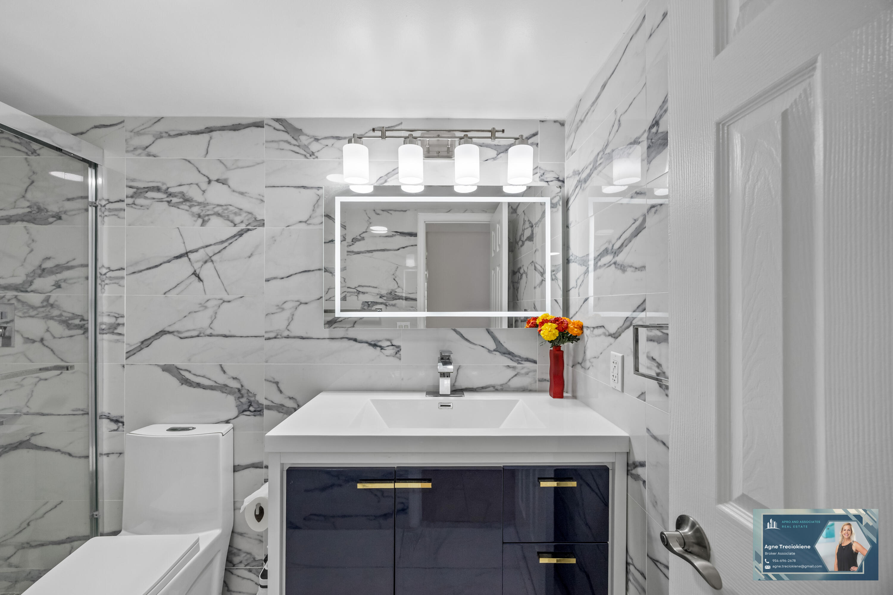 2801 Northeast 183rd Street, Unit 1606W Aventura, FL 33160 - Photo 23 of 53 a bathroom with a sink and a mirror