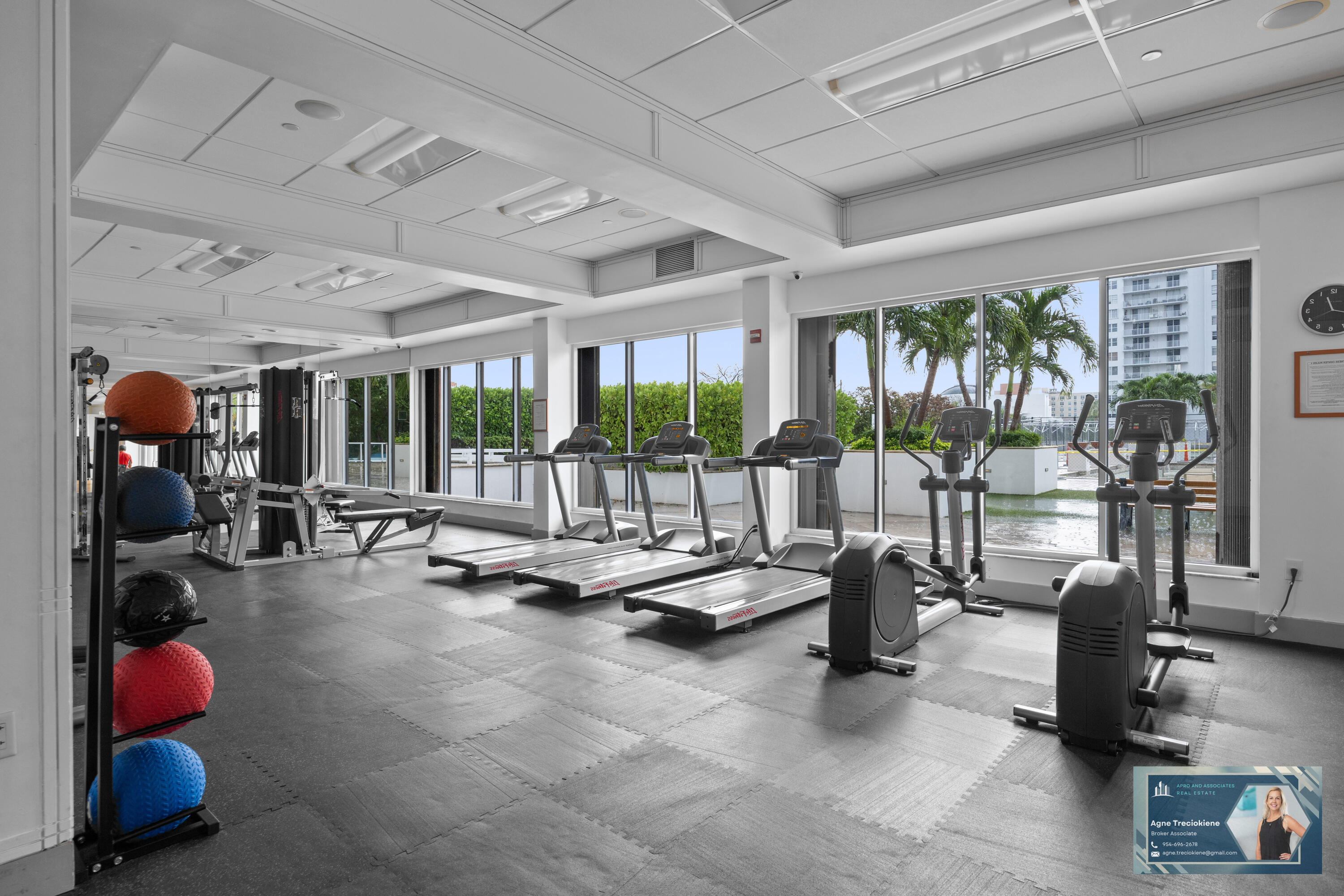2801 Northeast 183rd Street, Unit 1606W Aventura, FL 33160 - Photo 38 of 53 a room with gym equipment and large windows