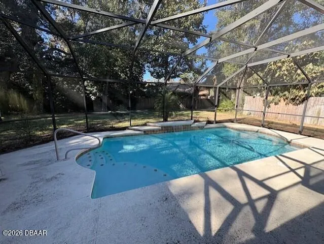 a view of a backyard with sitting area