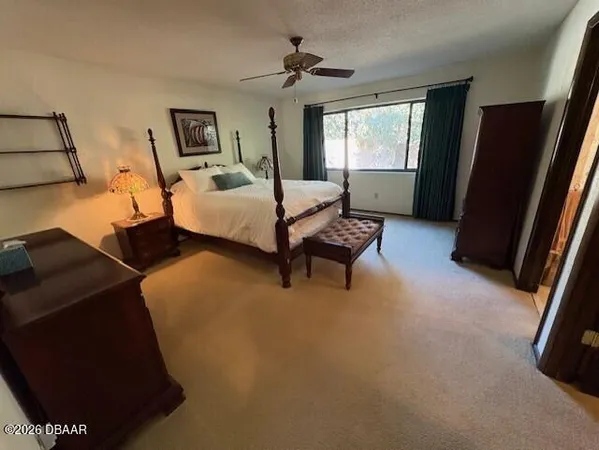 a bedroom with furniture and a window