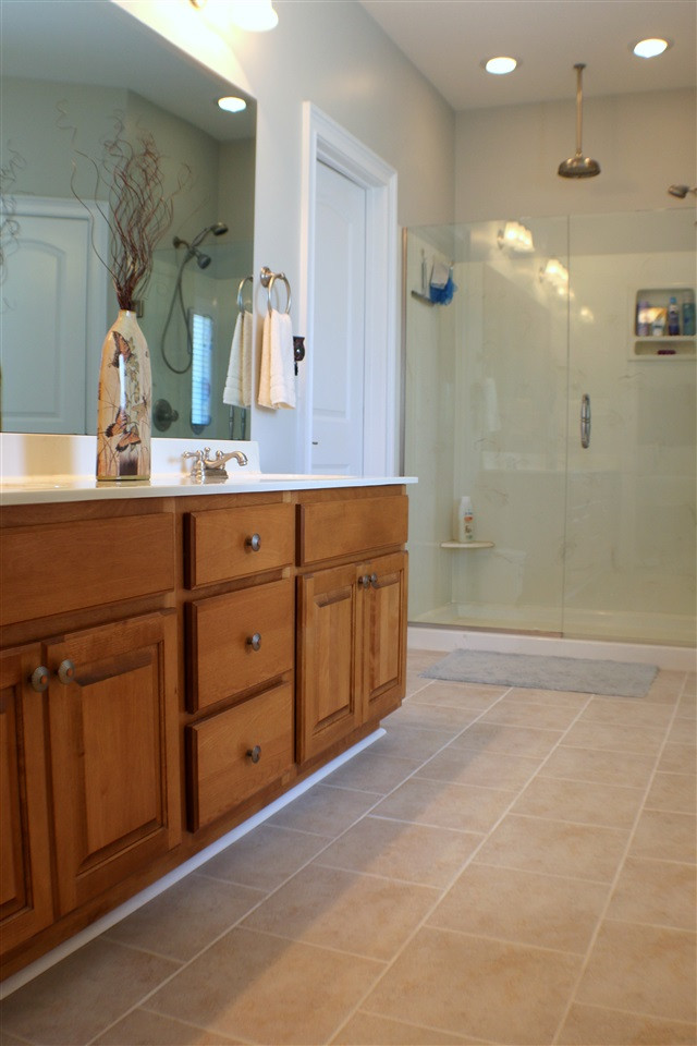 820 Hood Farm Road Clayton, NC 27520 - Photo 7 of 20 This custom Master Bath features brand new TILE FLOORING, double vanity, GARDEN TUB, 22-inch mirrored TV with amplifier system, & WALK IN CLOSET with organization system. Master Bath