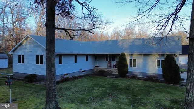 a view of house with yard and entertaining space