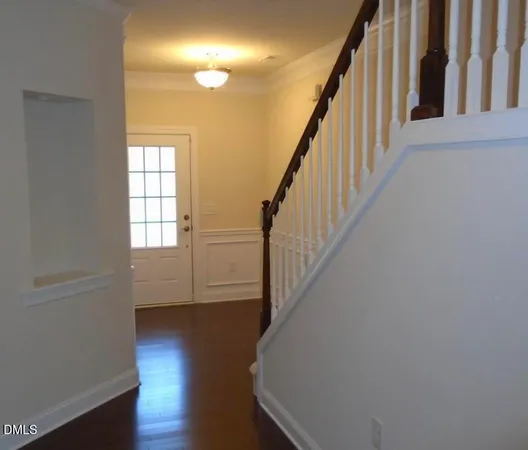 a view of entryway with wooden floor
