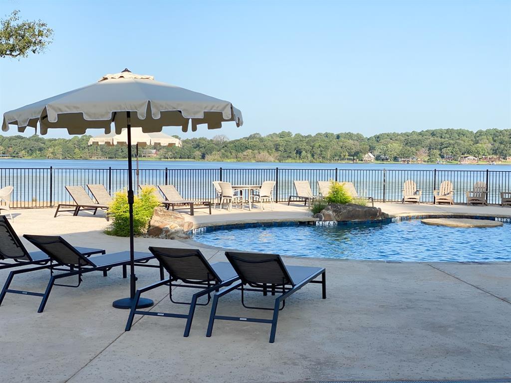 Lot 82 Bauer Boulevard Corsicana, TX 75109 - Photo 3 of 36 a swimming pool with outdoor seating and yard