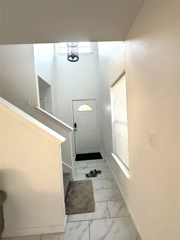 a bathroom with a tub shower and sink
