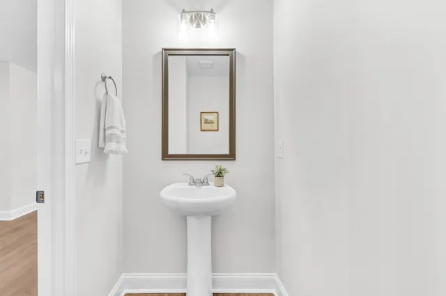 a bathroom with a sink and mirror