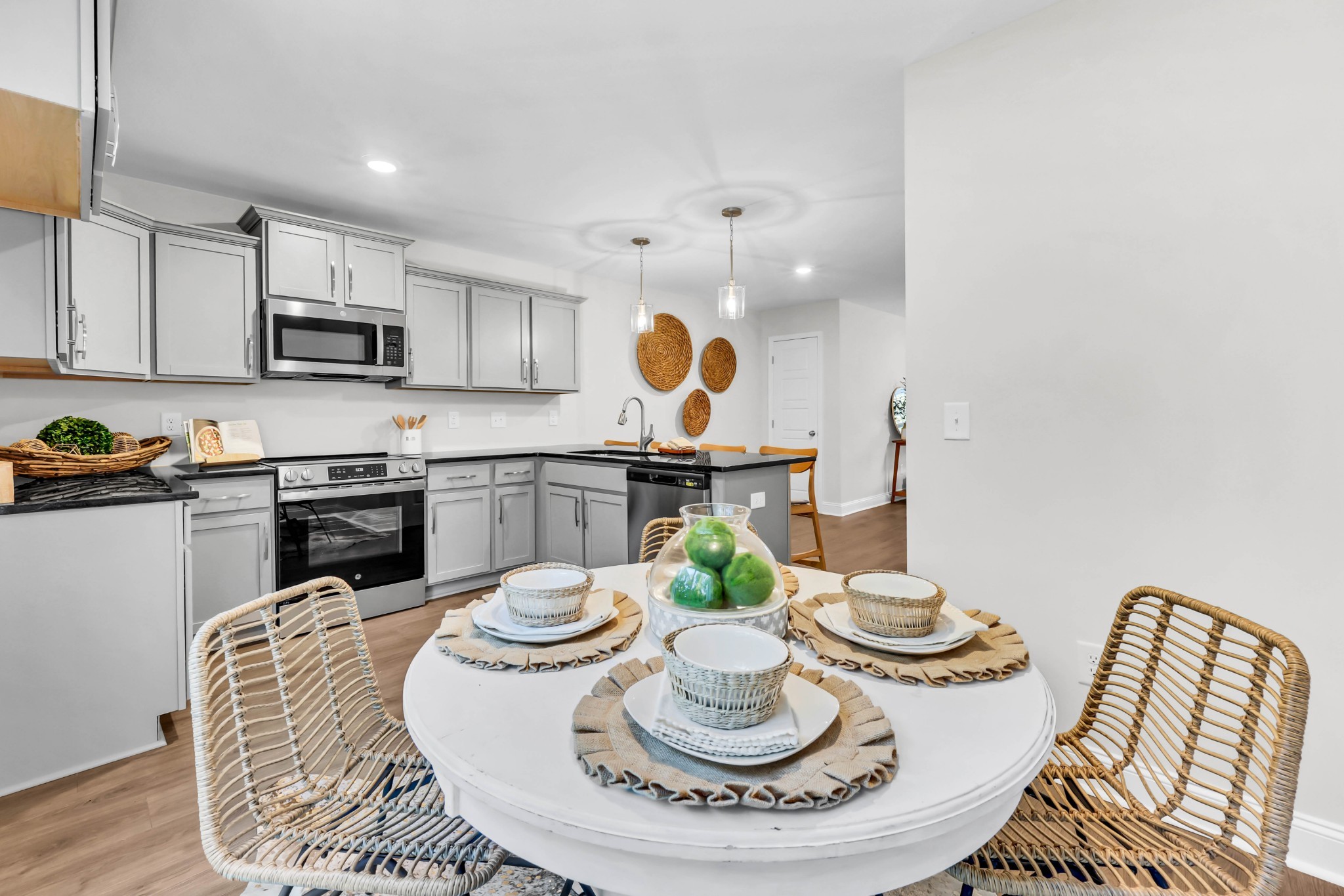 131 Quarry Point Drive, Unit C131 Clarksville, TN 37043 - Photo 18 of 33 a kitchen with a stove a sink and a dining table