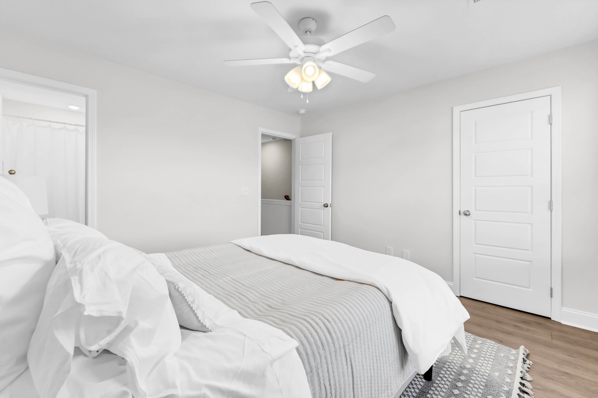 131 Quarry Point Drive, Unit C131 Clarksville, TN 37043 - Photo 28 of 33 a bedroom with a bed and a ceiling fan