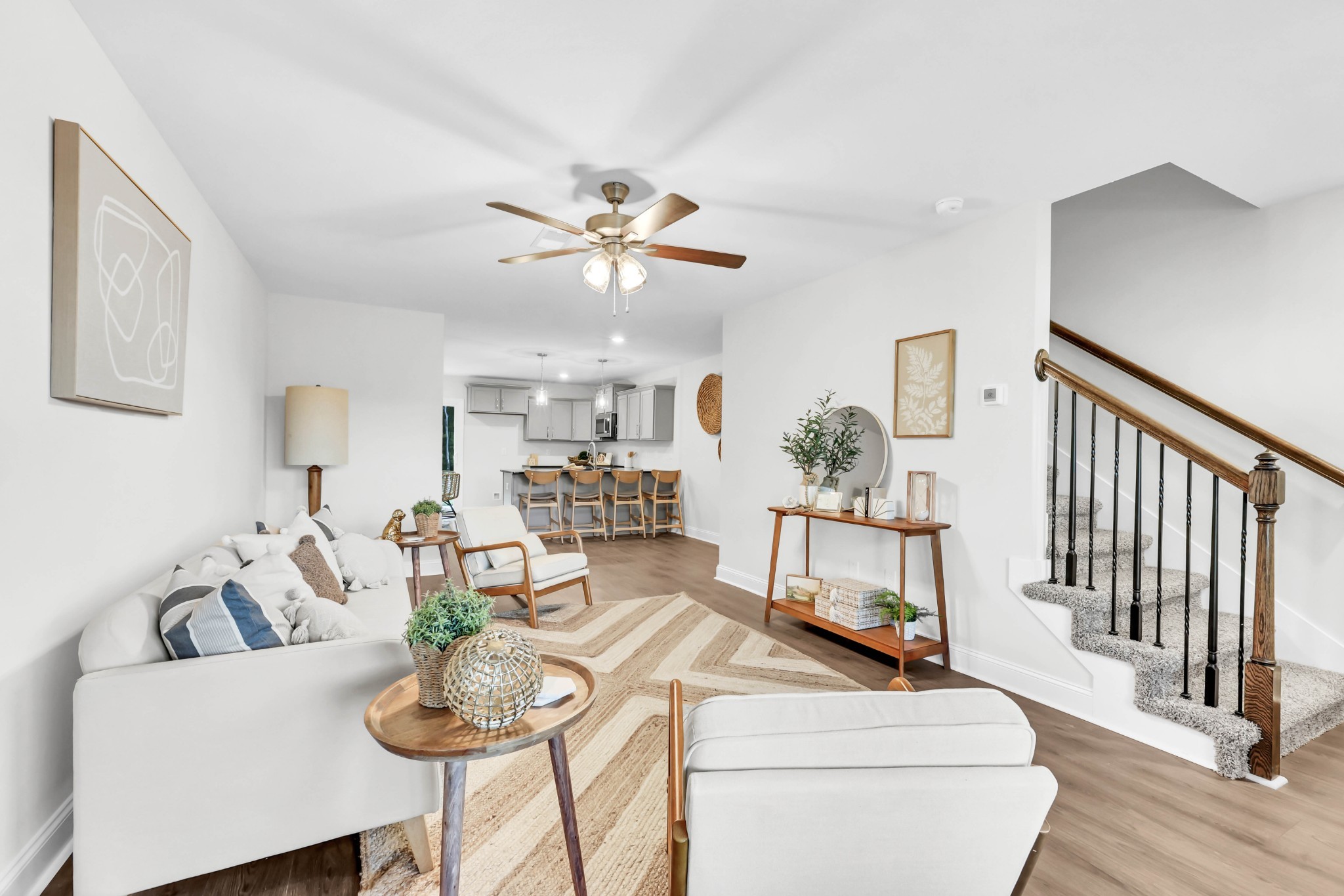 131 Quarry Point Drive, Unit C131 Clarksville, TN 37043 - Photo 7 of 33 a living room with furniture a fireplace and a chandelier