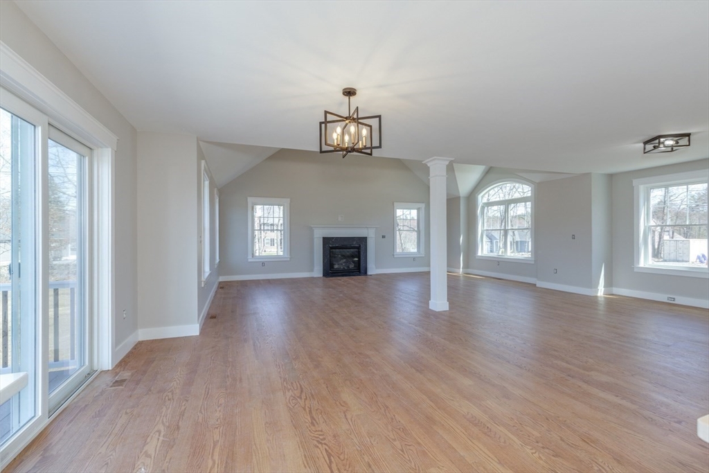 4 Haystack Circle Pelham, NH 03076 - Photo 21 of 39 wooden floor in an empty room with a window