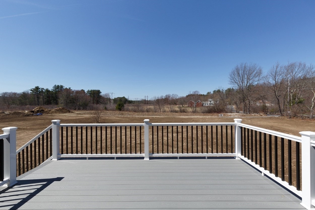 4 Haystack Circle Pelham, NH 03076 - Photo 34 of 39 a view of a balcony with wooden fence