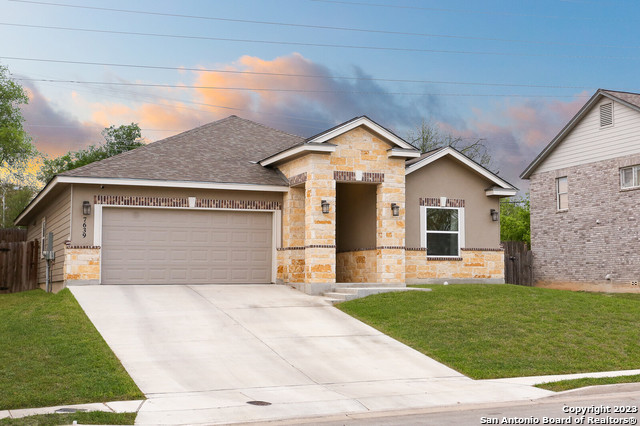 7639 Avery Road Live Oak, TX 78233 - Photo 1 of 1 a front view of house with yard and garage