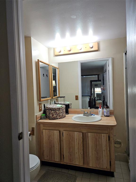 10601 Northwest 11th Street, Unit 10601 Hollywood, FL 33026 - Photo 5 of 9 a bathroom with a sink and a mirror