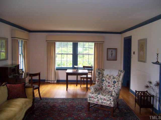 2609 Churchill Road Raleigh, NC 27608 - Photo 2 of 10 a living room with furniture and a large window