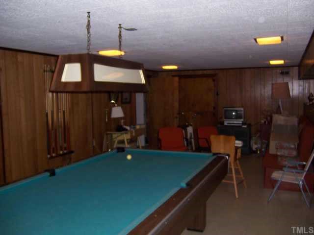 2609 Churchill Road Raleigh, NC 27608 - Photo 7 of 10 a room with pool table and a chandelier