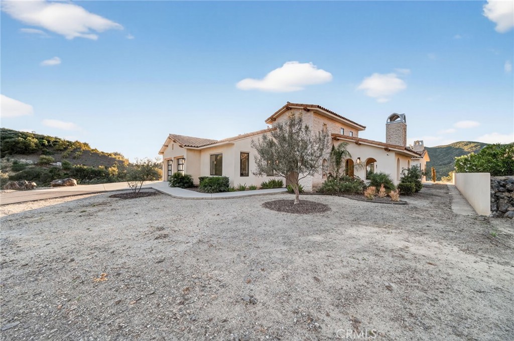 43754 De Luz Road Temecula, CA 92590 - Photo 21 of 74 a view of a house with a yard