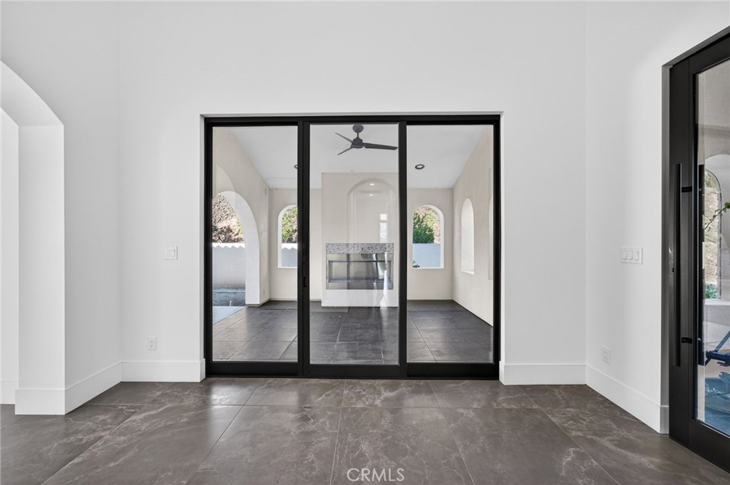 43754 De Luz Road Temecula, CA 92590 - Photo 25 of 74 an empty room with sliding glass door and shower