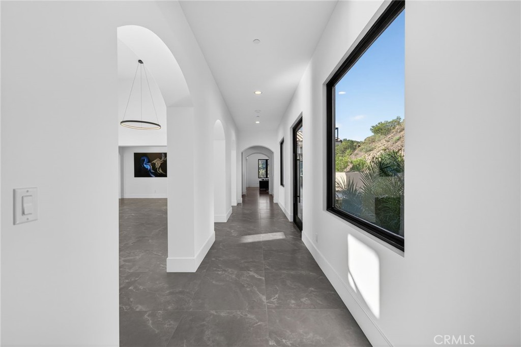 43754 De Luz Road Temecula, CA 92590 - Photo 26 of 74 a view of a hallway view with staircase
