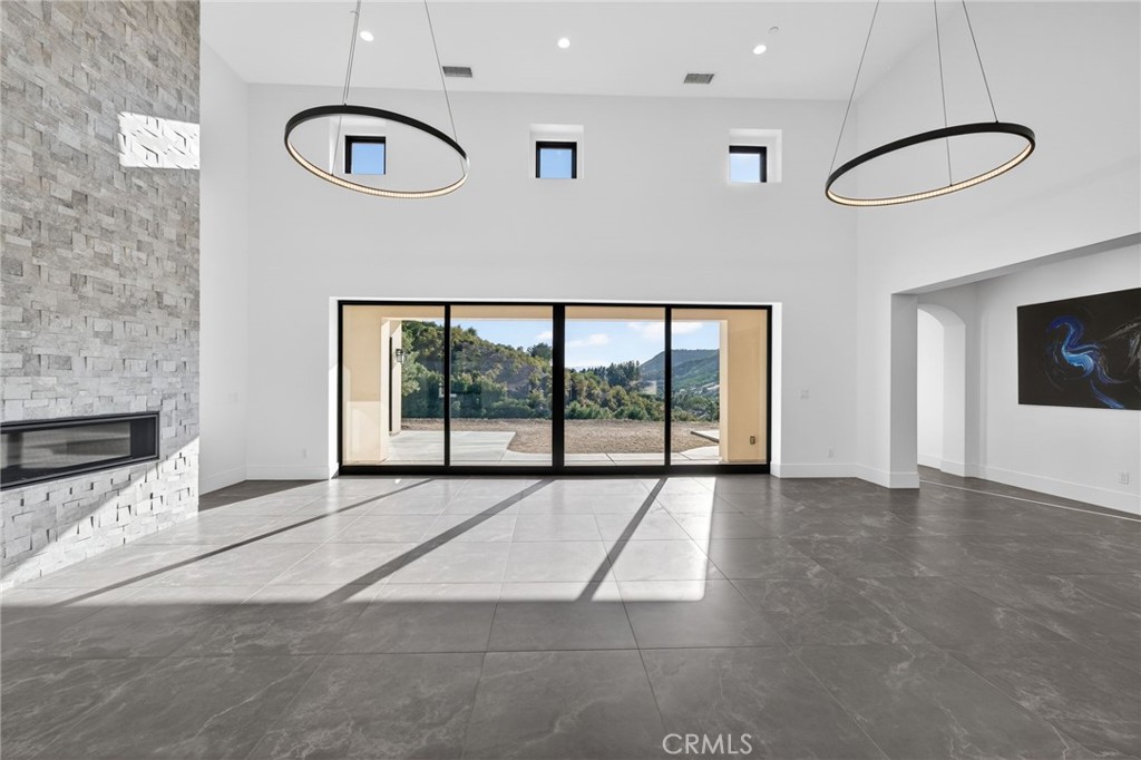 43754 De Luz Road Temecula, CA 92590 - Photo 30 of 74 a view of an empty room with a window and kitchen view