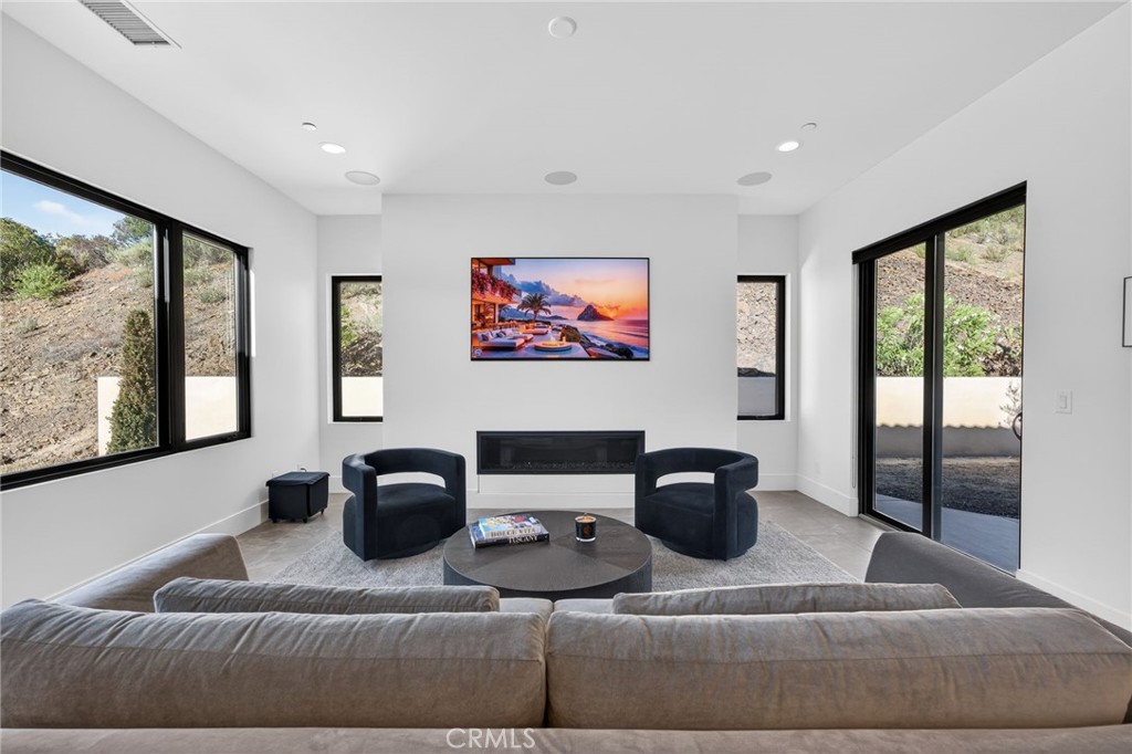 43754 De Luz Road Temecula, CA 92590 - Photo 36 of 74 a living room with furniture and a large window