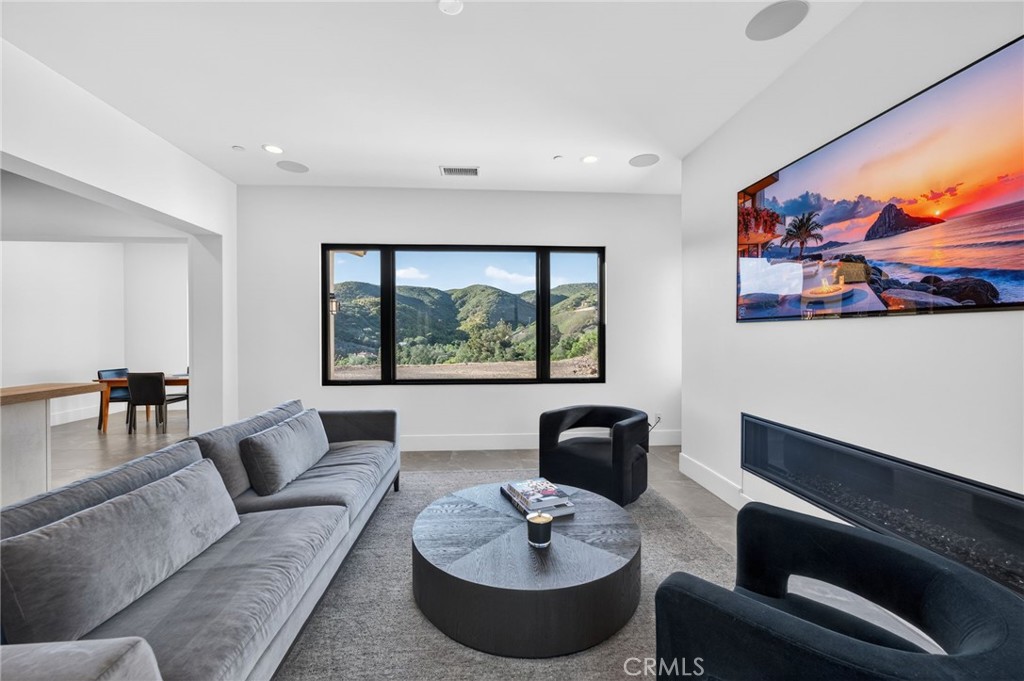 43754 De Luz Road Temecula, CA 92590 - Photo 37 of 74 a living room with furniture and a large window
