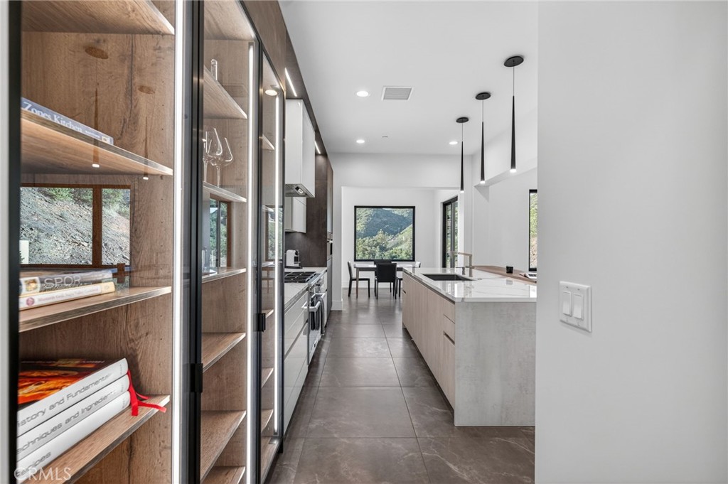 43754 De Luz Road Temecula, CA 92590 - Photo 47 of 74 a large white kitchen with a large window