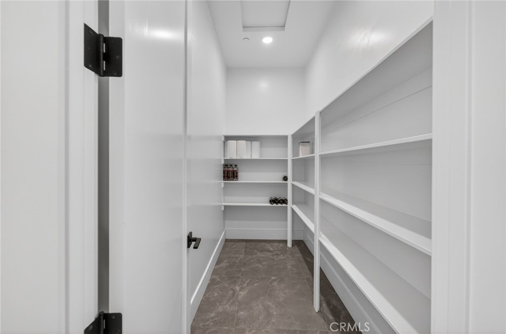 43754 De Luz Road Temecula, CA 92590 - Photo 50 of 74 a view of walk in closet with empty racks